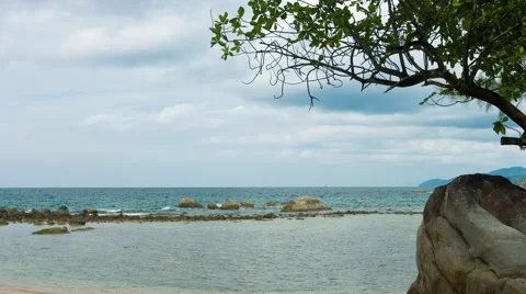 Rocky Tropical Beach under Overcast Sky. Video UltraHD Stock Footage 60563653