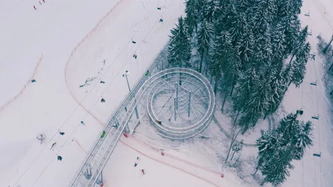 Rodelbahn in the winter forest in the mountains. circle rodelbahn Stock Footage 147205385