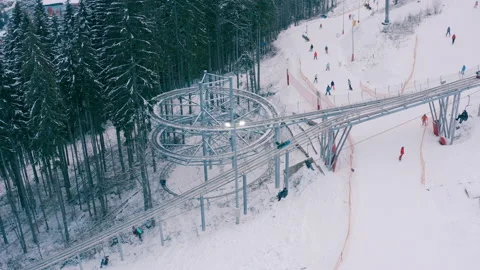 Rodelbahn in the winter forest in the mountains. circle rodelbahn Stock Footage 147492003