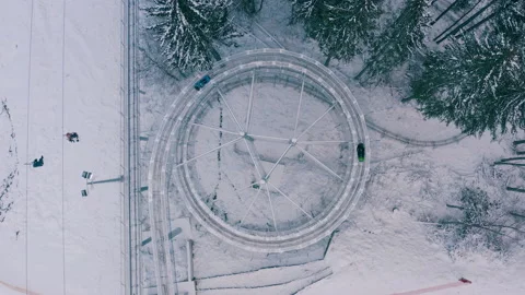 Rodelbahn in the winter forest in the mountains. circle rodelbahn Stock Footage 147492223