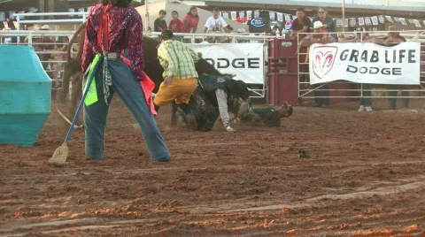 Rodeo bull mad after ride attacks clown M HD Stock Footage