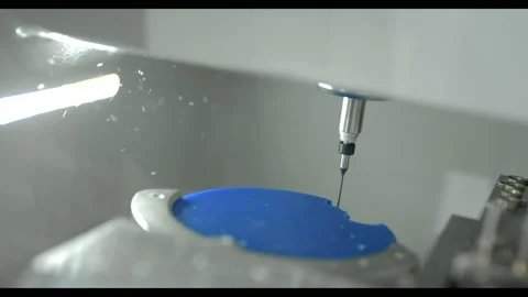Rofessional CNC dental milling machine carving out shape of artificial teeth in Stock Footage 140134161