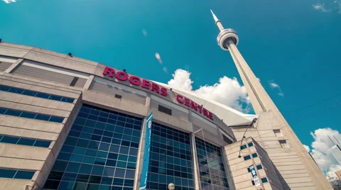 Rogers Centre CN Tower Toronto Low Angle Tourism Blue Sky Clouds Timelapse 5k Video stock 66857349