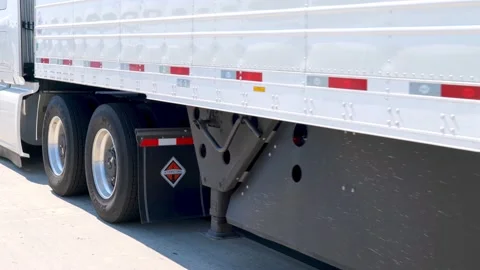 ROGERS, MN - 20 JUL 22: Semi truck and trailer viewed from a passing car. Stock Footage 202146909