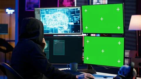 Rogue computer scientist uses AI and green screen PC to develop malware. Stockfoto's