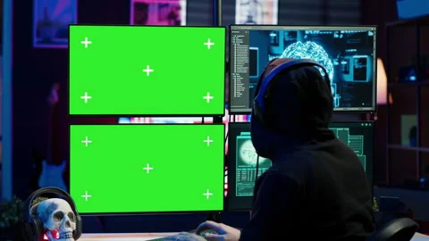 Rogue developer working on green screen computer using artificial intelligence Stock Footage 275864921