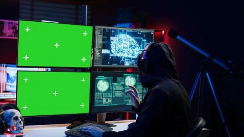 Rogue developer working on green screen computer using artificial intelligence 스톡 사진