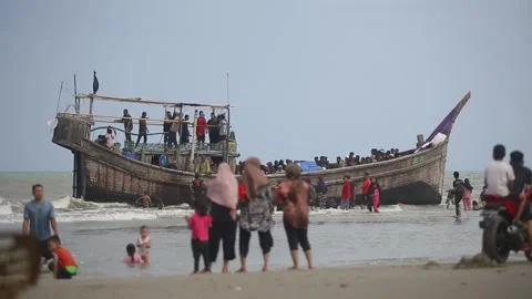 Rohingya immigrant ship stranded in Aceh, Indonesia Stock Footage 300367706