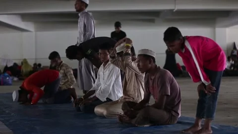 Rohingya remain in temporary shelter in Aceh, INDONESIA, ID - 13 Dec 2023 Stock Footage 258445473