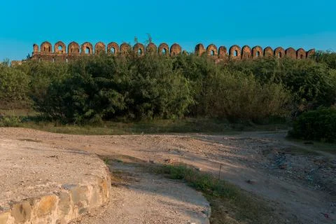 Rohtas Fort wall view surrounded by green bushes Stock Photos