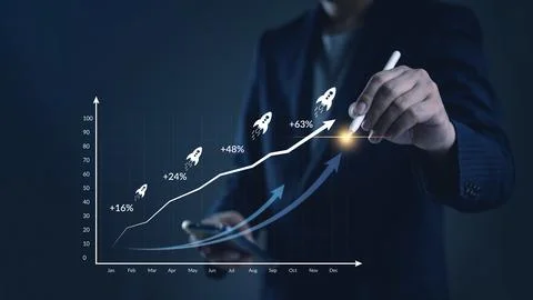 ROI, analytics Manager visualizes monthly KPI line in a workspace to optimi.. Stock Photos