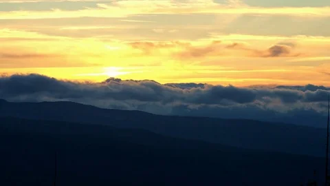 Roiling sunset clouds in the distance orange Stock Footage 81861768