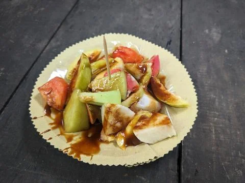 Rojak is a fruit salad dish that is often found in Indonesia, topped with l.. Stock Photos
