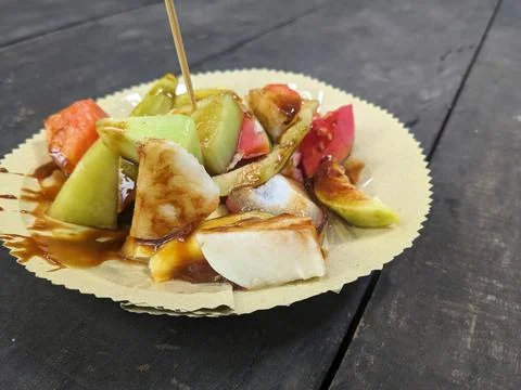 Rojak is a fruit salad dish that is often found in Indonesia, topped with l.. Stock Photos