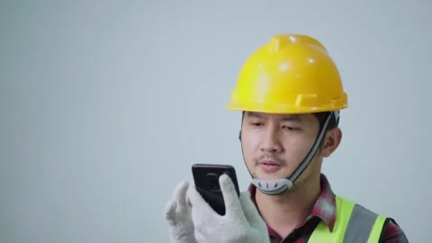 The Role of the Foreman's Phone in Construction. Stock Footage 243706122