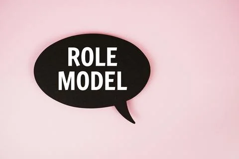 Role Model text with speech bubble top view on pink background Stock Photos