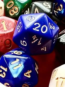 Role Playing Dice. Multi coloured and including a D20 Stock Photos