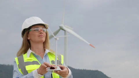 The role of a Renewable Energy Engineer involves the detailed evaluation and Stock Footage 340921387