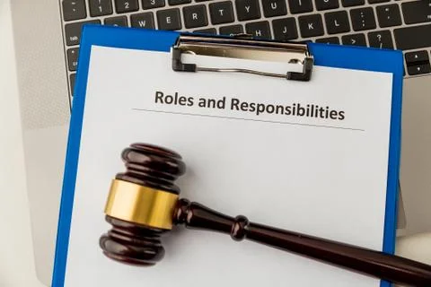 Roles and responcibilities document in the tablet at the desk. Stock Photos