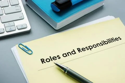 Roles And Responsibilities documents in the office. Stock Photos