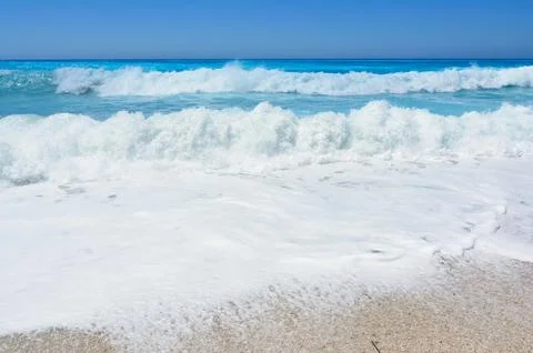Roling waves on Lefkada beach Stock Photos