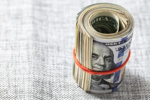Roll of 100 dollar banknotes Stock Photos