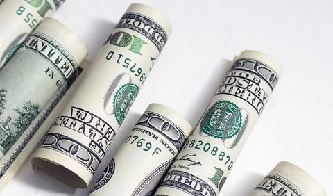 Roll of 100 dollar bills on background Stock Photos