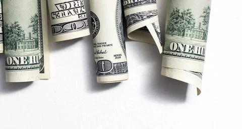 Roll of 100 dollar bills on background Stock Photos