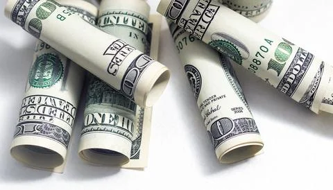 Roll of 100 dollar bills on background Stock Photos