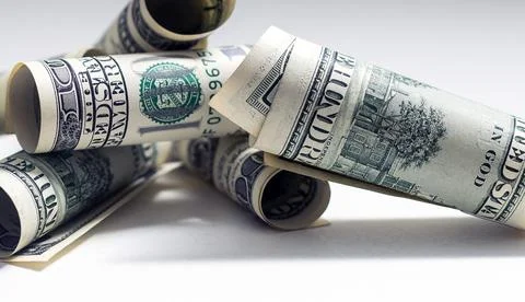 Roll of 100 dollar bills on background Stock Photos
