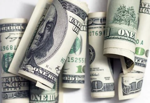 Roll of 100 dollar bills on background Stock Photos