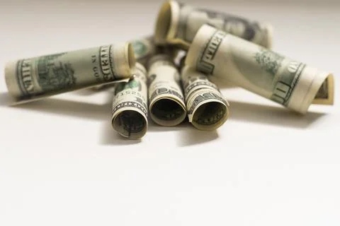 Roll of 100 dollar bills on background Stock Photos