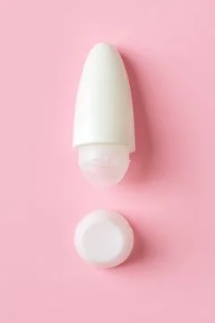 Roll on antiperspirant as the exclamation point shape on a pink background. 스톡 사진