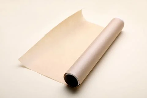Roll of baking paper on beige background Stock Photos