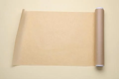 Roll of baking paper on beige background, top view Stock Photos