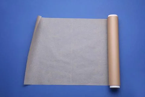 Roll of baking paper on blue background, top view Stock Photos