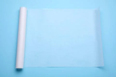 Roll of baking paper on light blue background, top view Stock Photos
