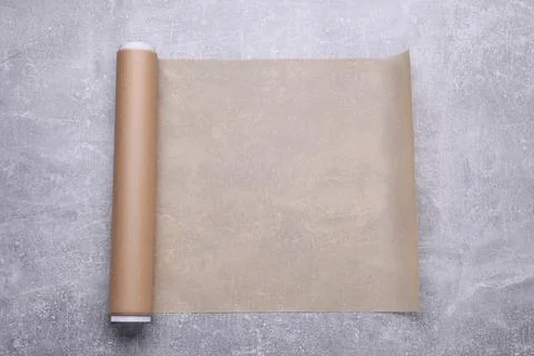 Roll of baking paper on light grey table, top view Stock Photos