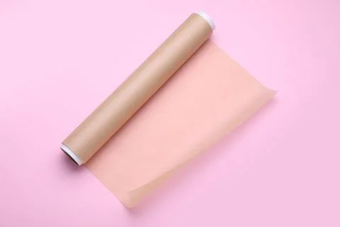 Roll of baking paper on pink background, top view Stock Photos