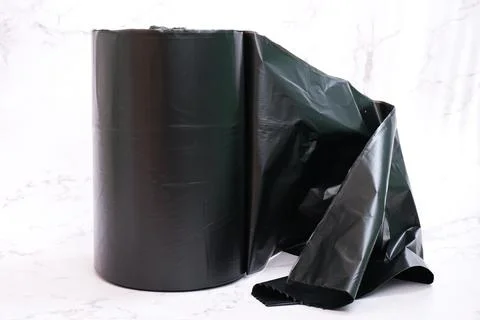 Roll of black garbage bag with white background Stock Photos