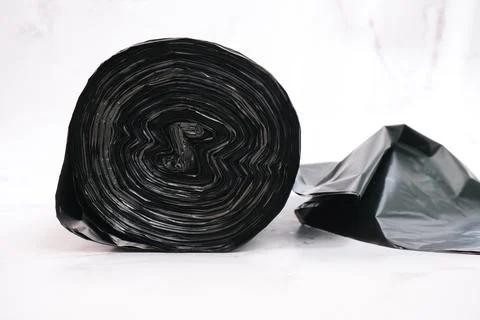 Roll of black garbage bag with white background Stock Photos