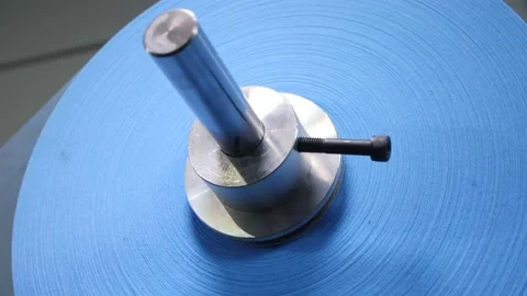 Roll of blue fabric for protective face masks rotates upper Stock Footage 131316113