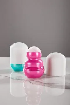 Roll bottles deodorant marble table Stock Photos