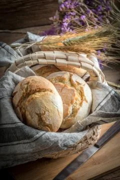 Roll breads in basket on table. Stock Photos