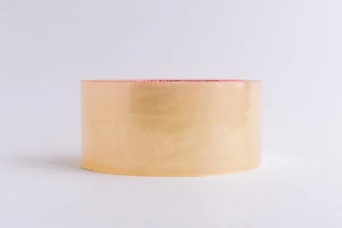 Roll of brown adhesive packaging tape isolated on a white background Stock Photos