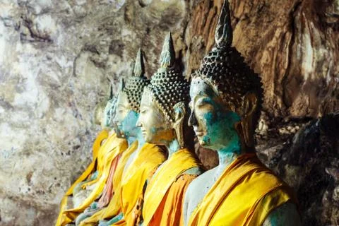 Roll of buddha statue in the cave Stock Photos