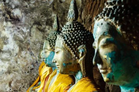 Roll of buddha statue in the cave Stock Photos