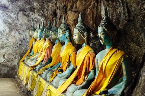 Roll of buddha statue in the cave Stock Photos