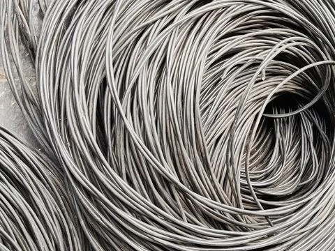 Roll of cable lying on the floor Stock Photos