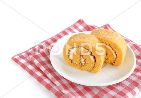Roll cake with cream on white Stock Photos